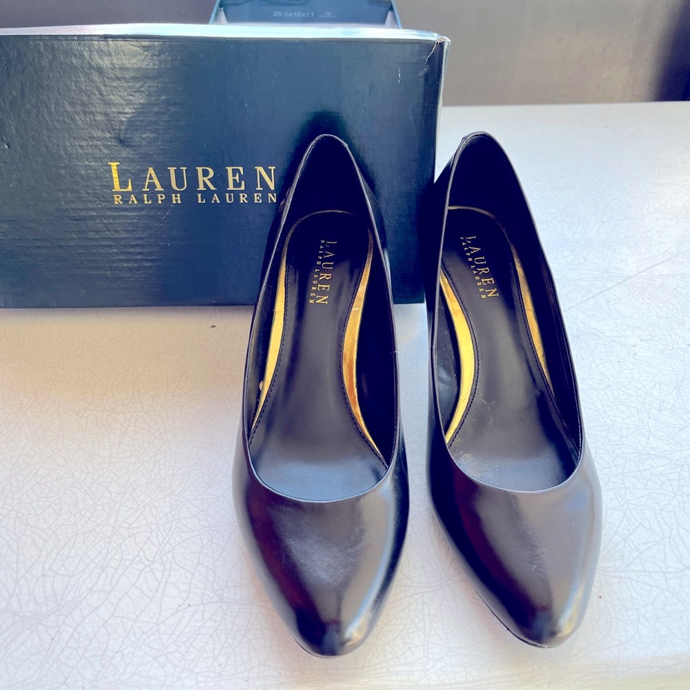 Well loved black leather women’s pumps.